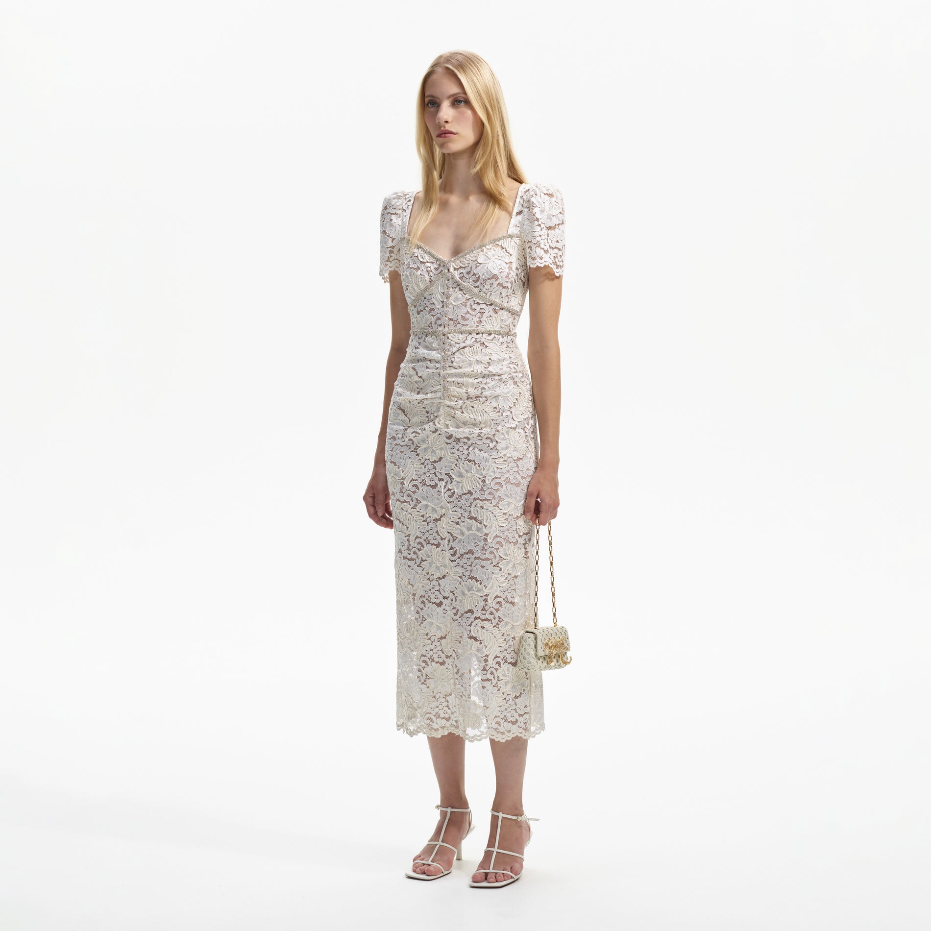 Side view of a woman wearing the Cream Cord Lace Midi Dress