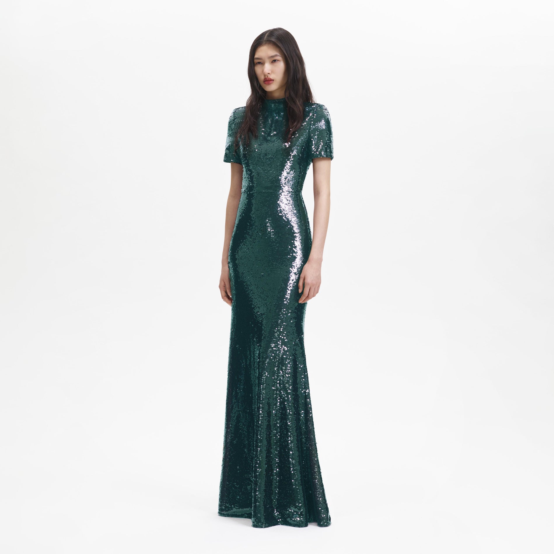 Side view of a woman wearing the Teal Sequin Maxi Dress