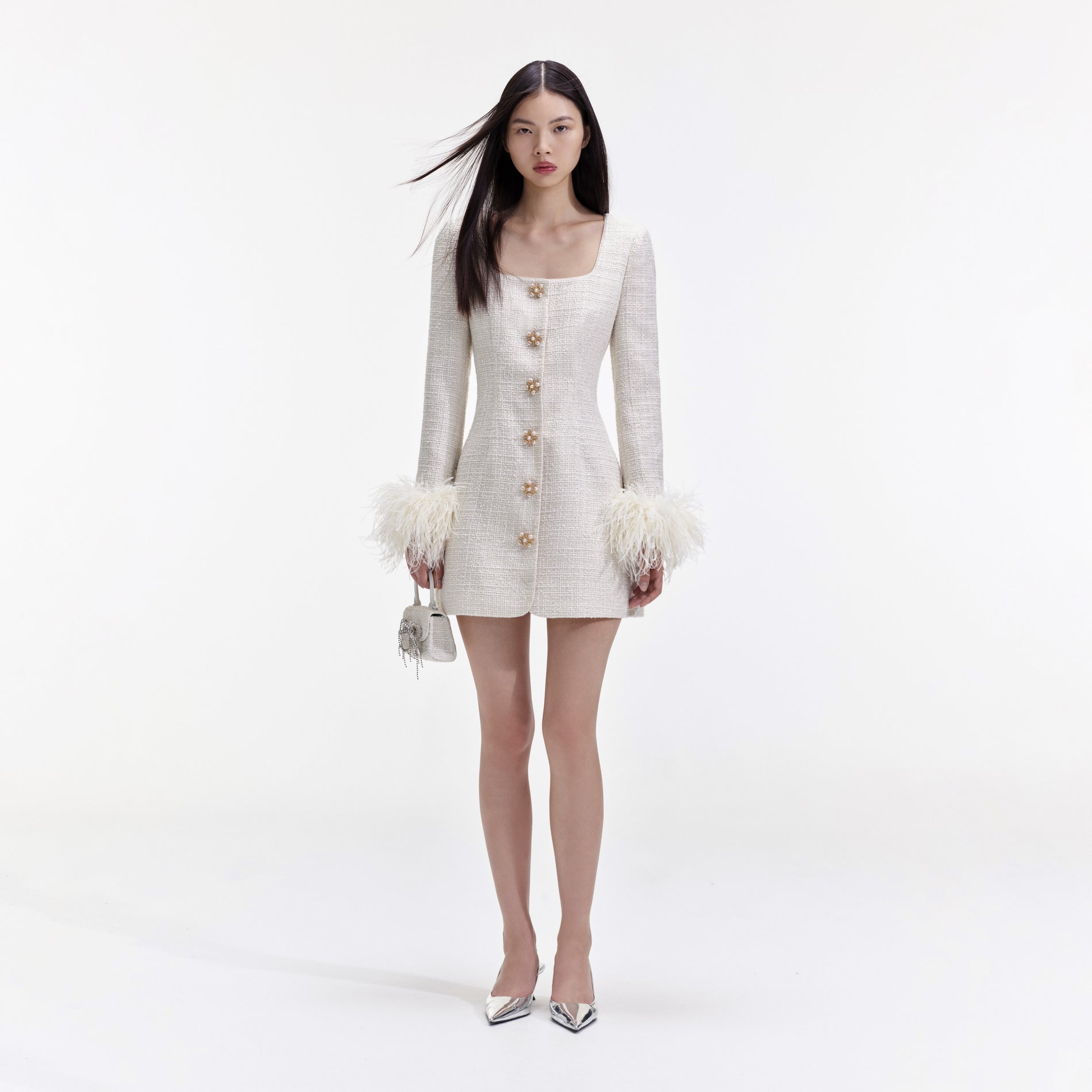 Front view of a woman wearing the Cream Boucle Feather Mini Dress