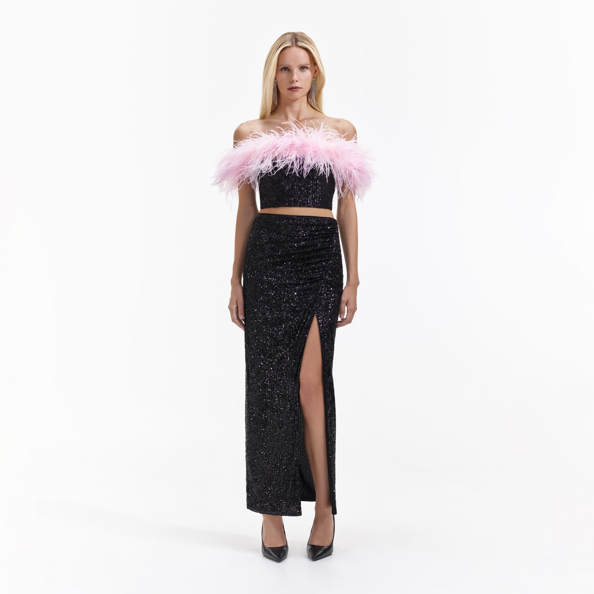 Front view of a woman wearing the Black Sequin Maxi Skirt