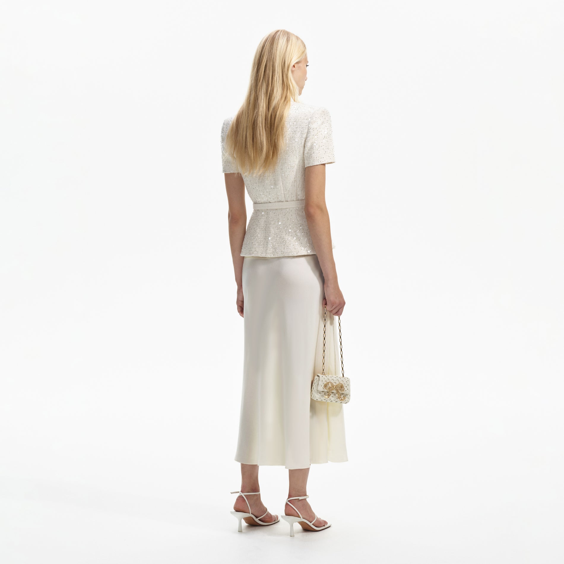 Back view of a woman wearing the Cream Sequin Boucle Midi Dress