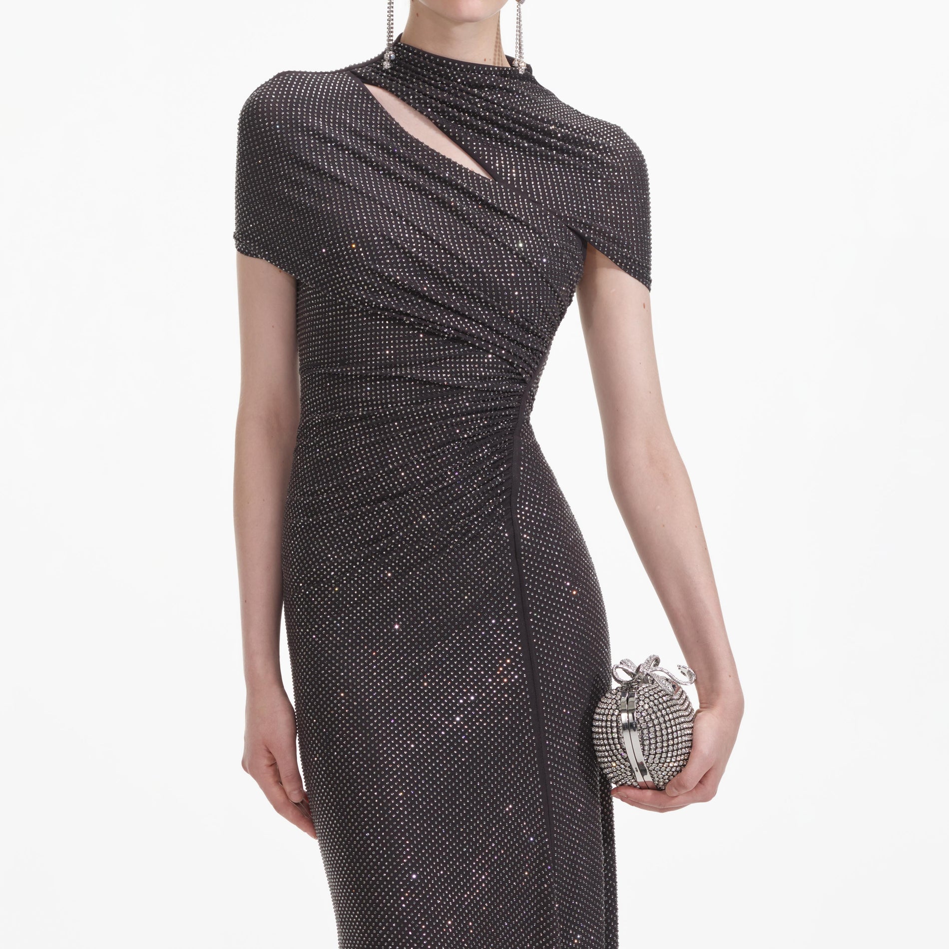 A close up of a woman wearing the Slate Rhinestone Mesh Cut Out Midi Dress