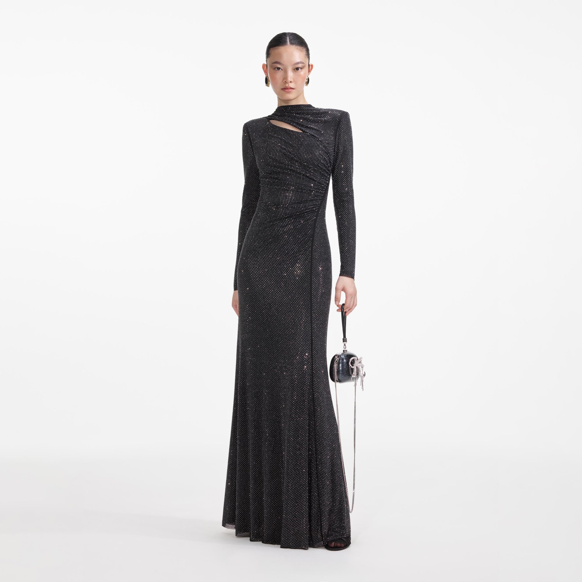 Front view of a woman wearing the Black Rhinestone Mesh Cut Out Maxi Dress