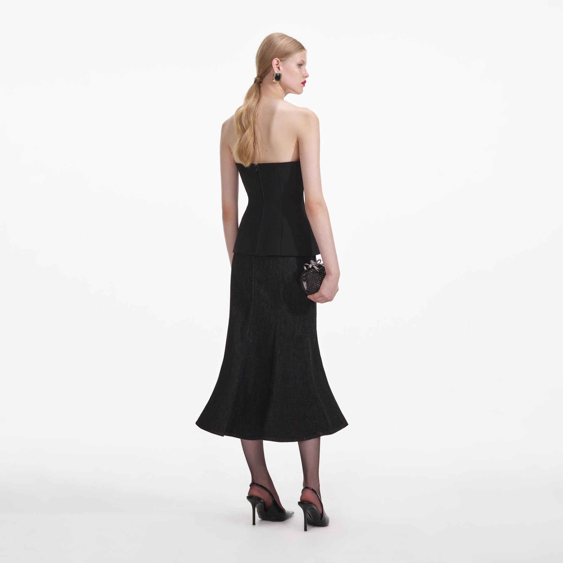 Back view of a woman wearing the Black Crepe Corsage Top