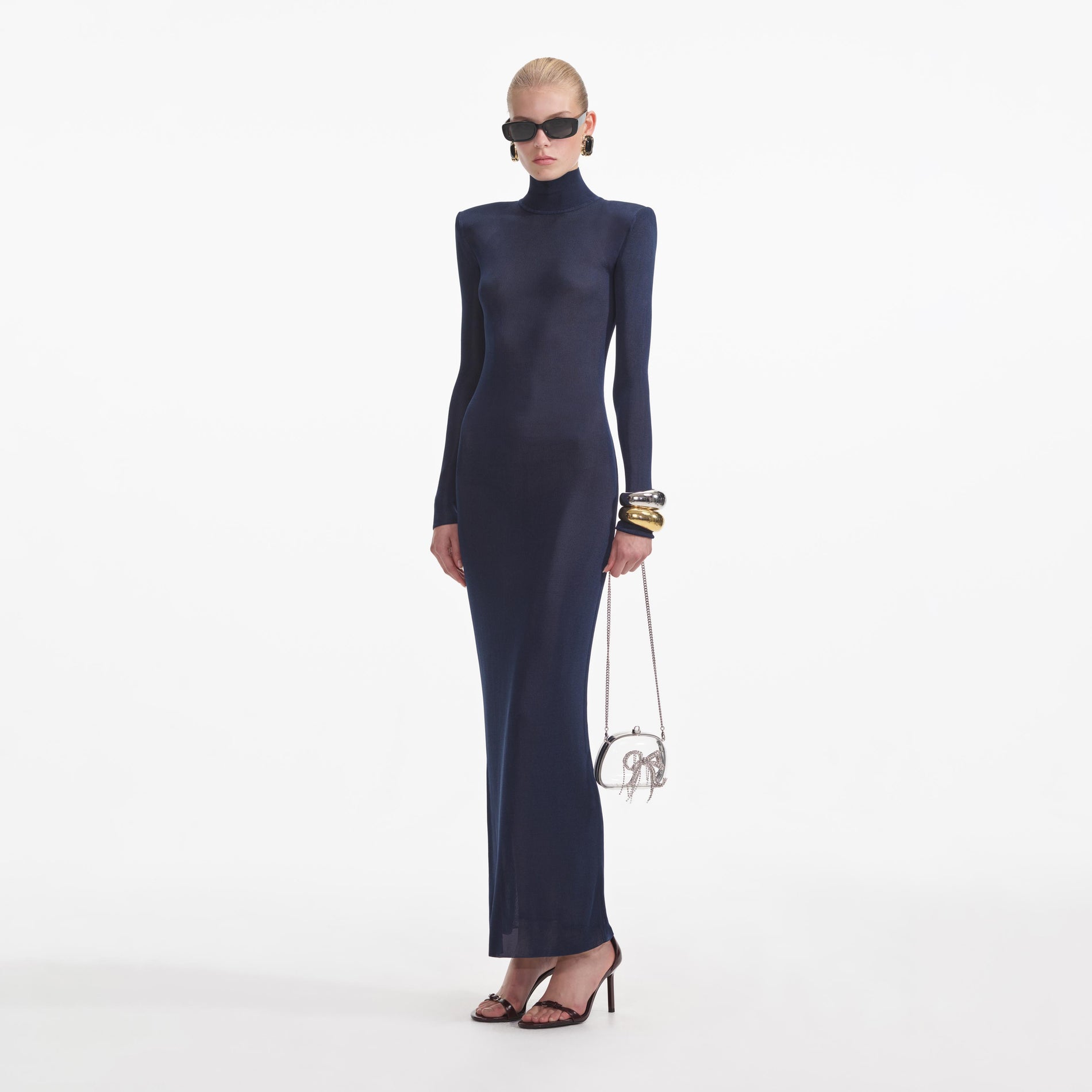 Side view of a woman wearing the Navy Viscose Knit Maxi Dress