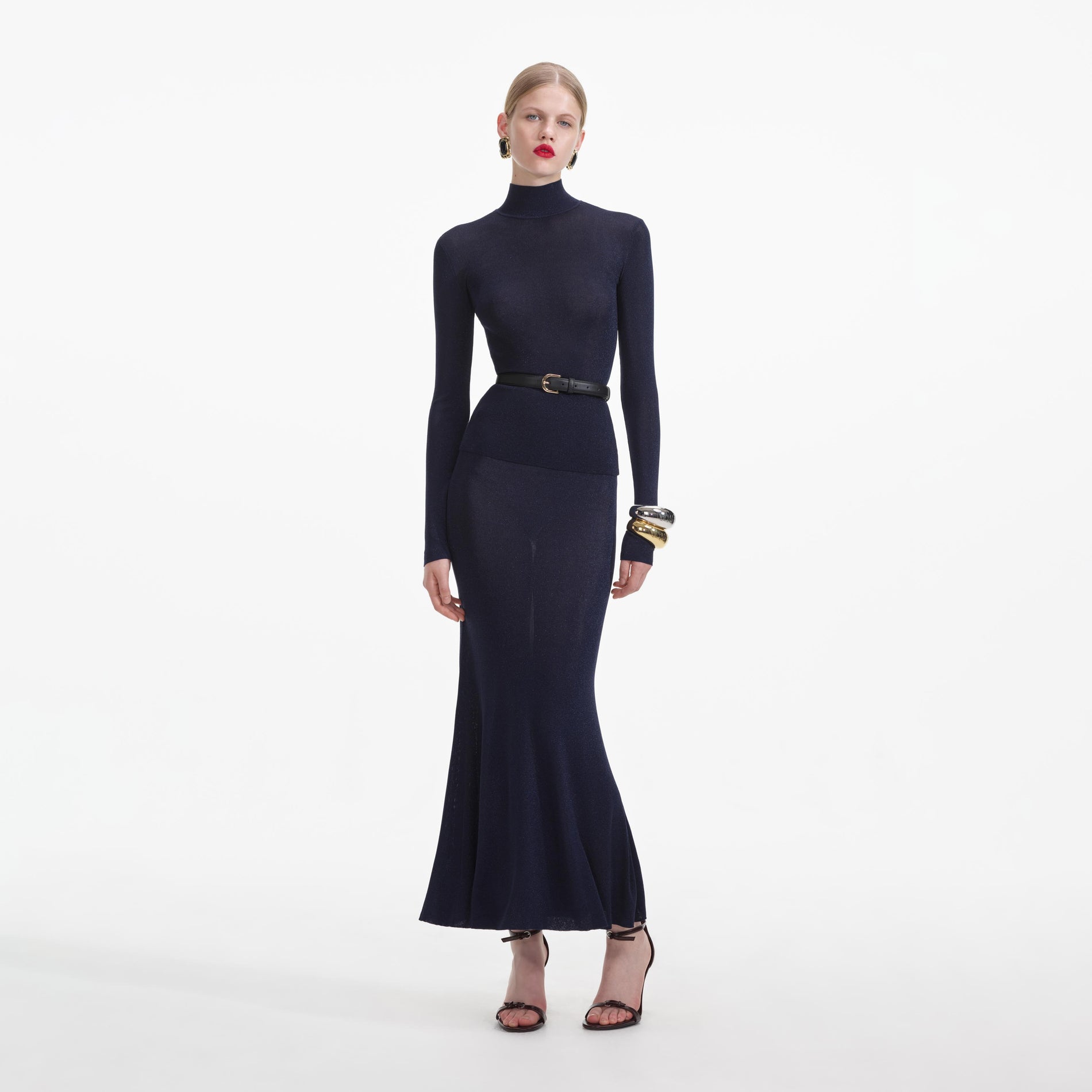 Front view of a woman wearing the Navy Viscose Knit Top