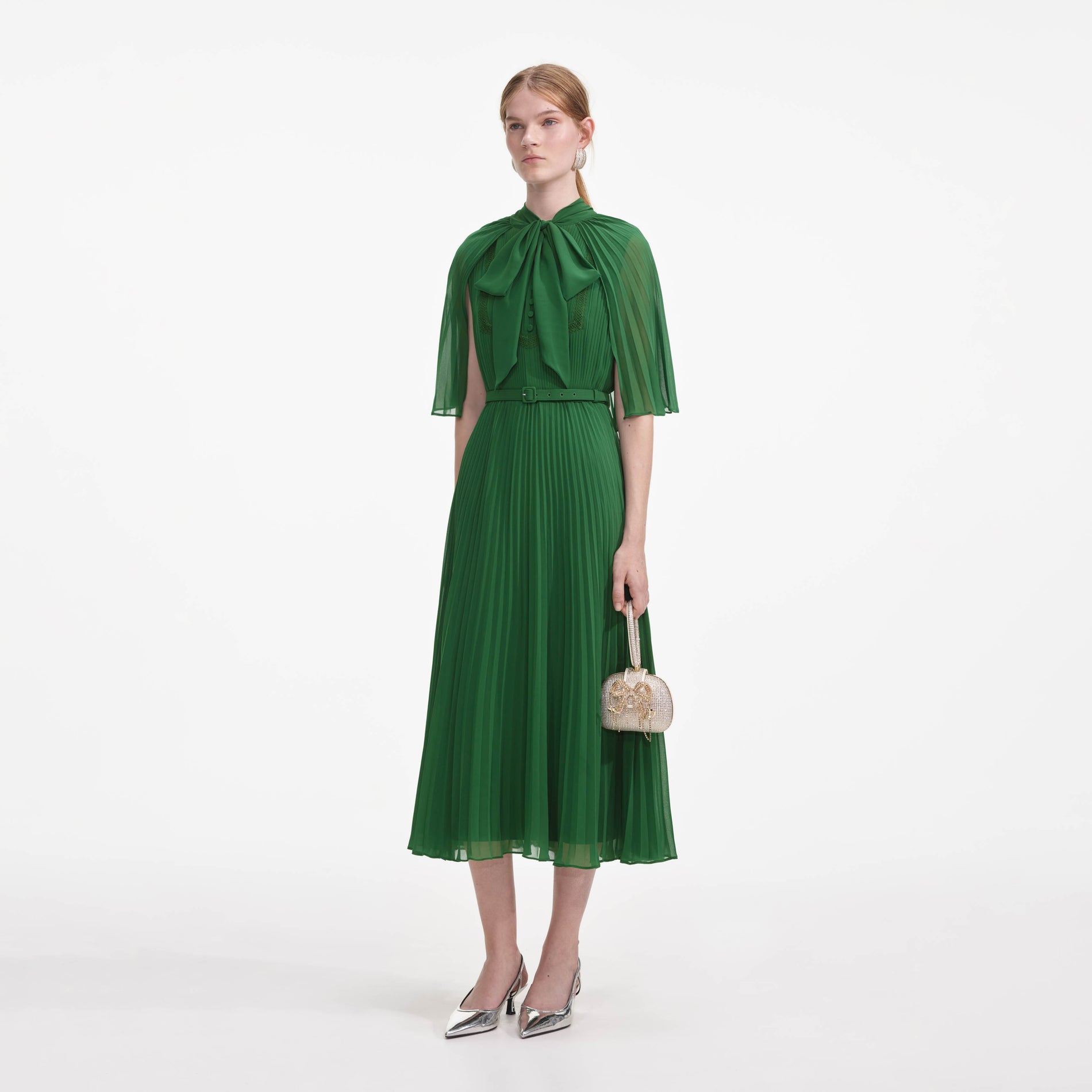 Side view of a woman wearing the Green Chiffon Cape Midi Dress