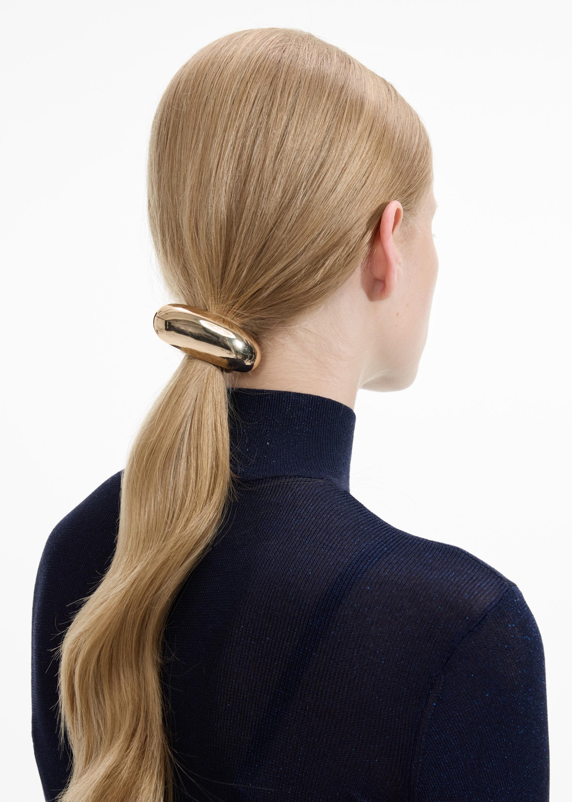 Front view of a woman wearing the Gold Bar Hair Cuff