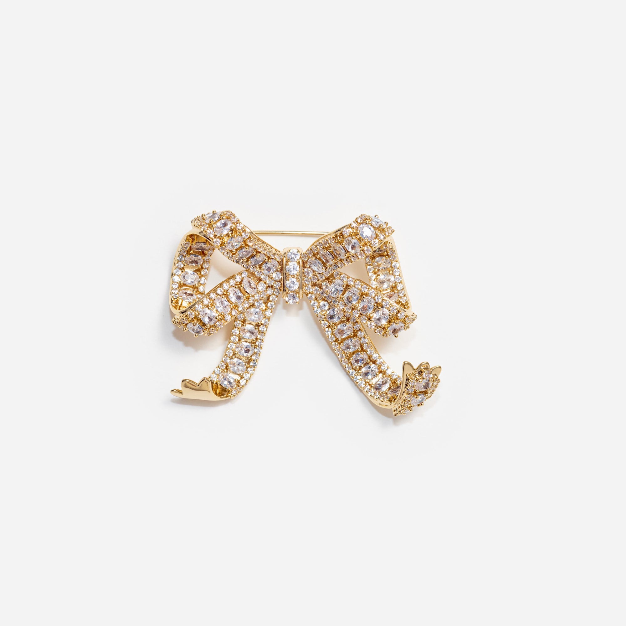 Front view of a woman wearing the Gold Crystal Bow Brooch