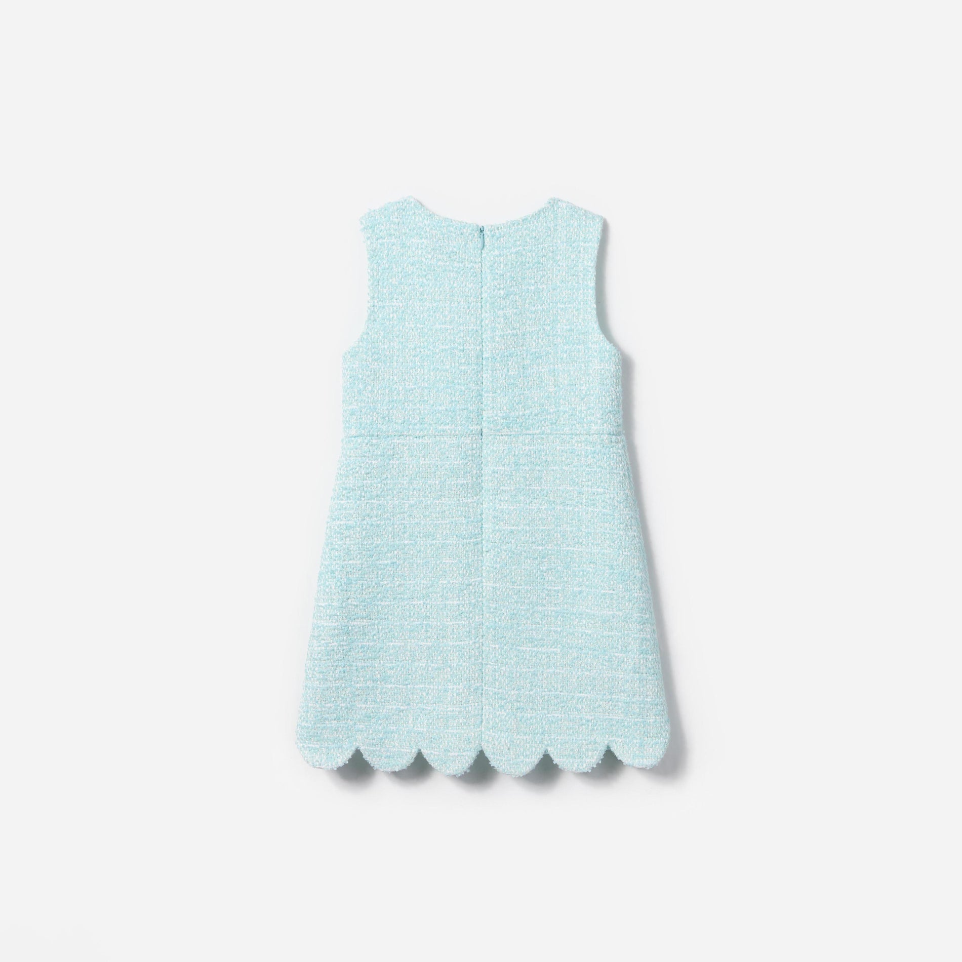 Side view of a woman wearing the Mint Boucle Dress
