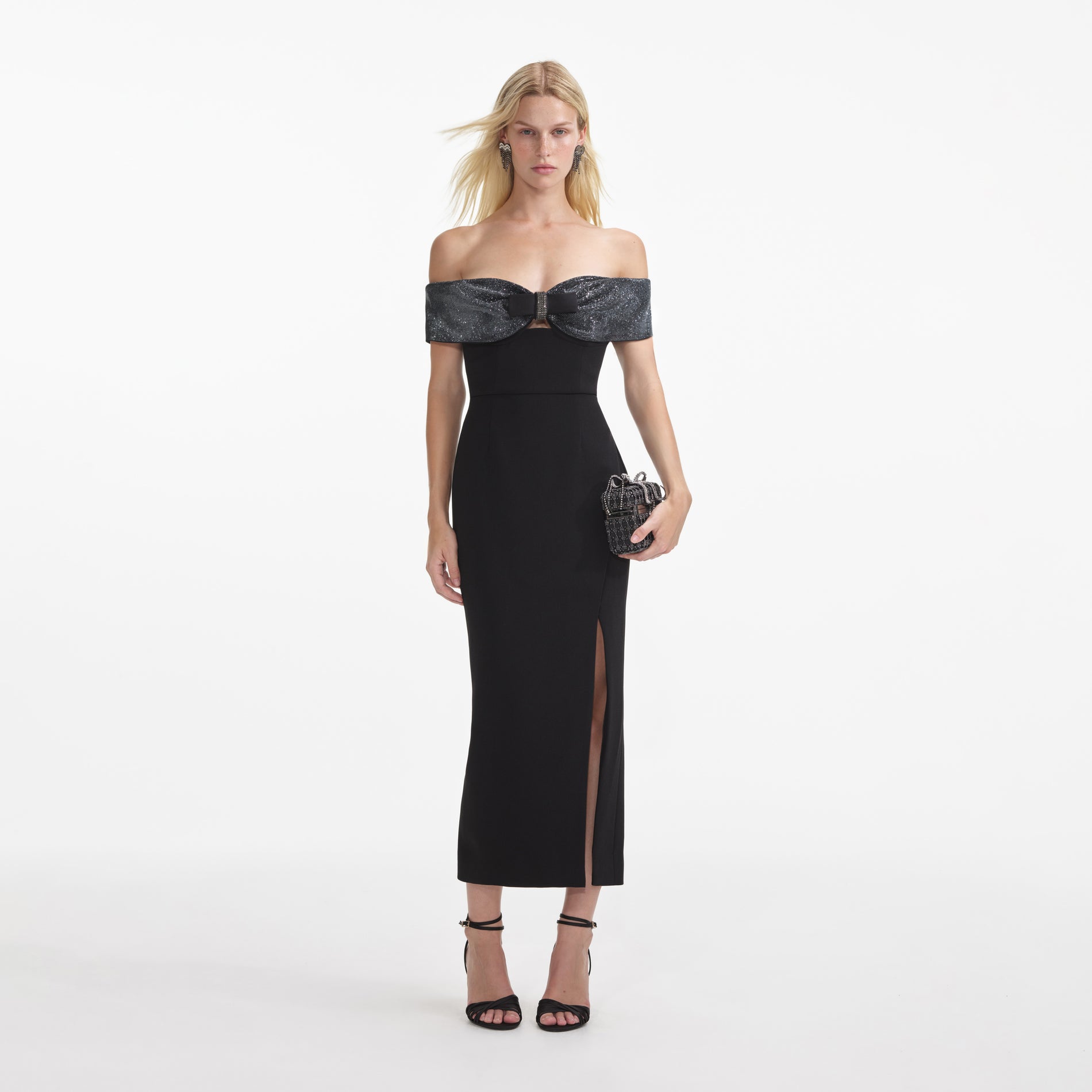 Front view of a woman wearing the Black Crepe Bow Midi Dress