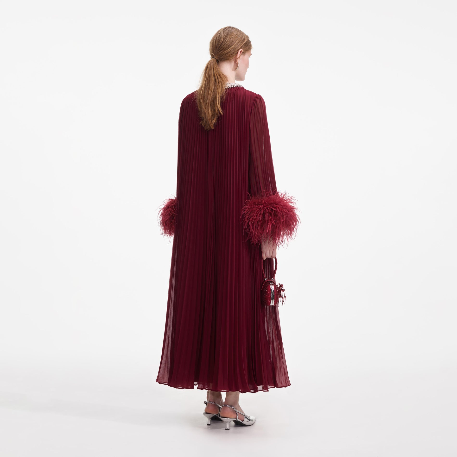 Back view of a woman wearing the Burgundy Chiffon Feather Midi Dress