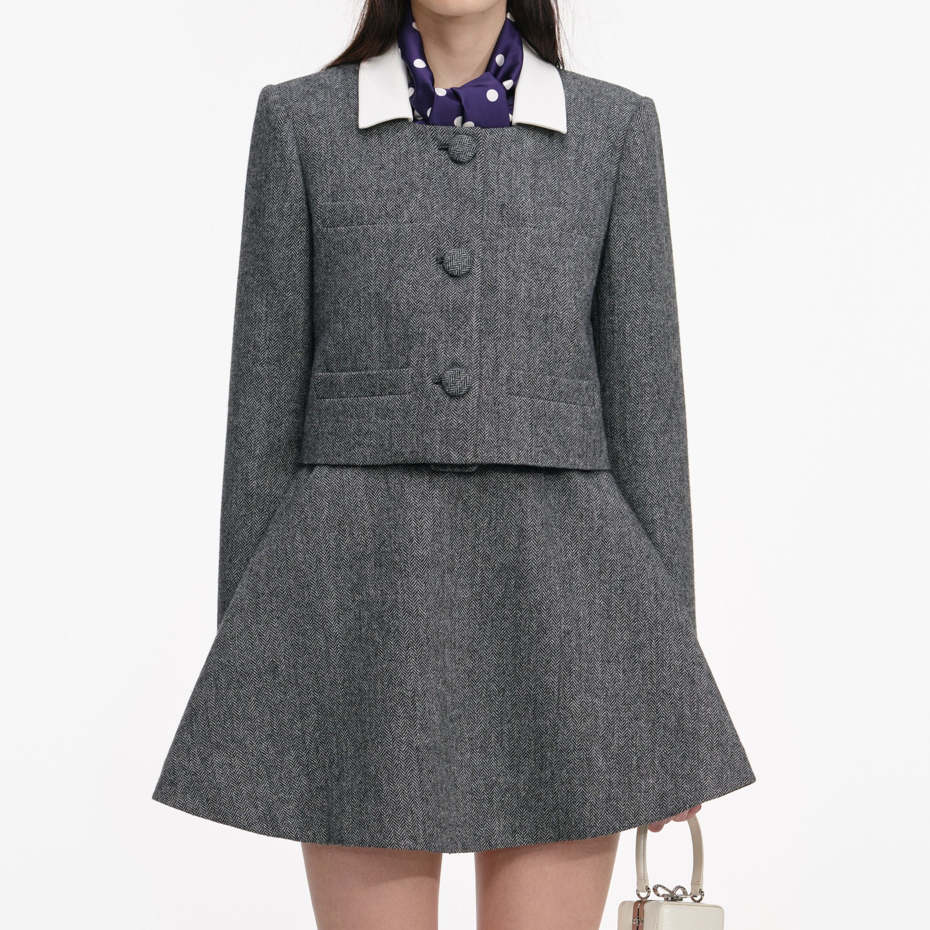 Side view of a woman wearing the Grey Herringbone Scarf Detail Jacket