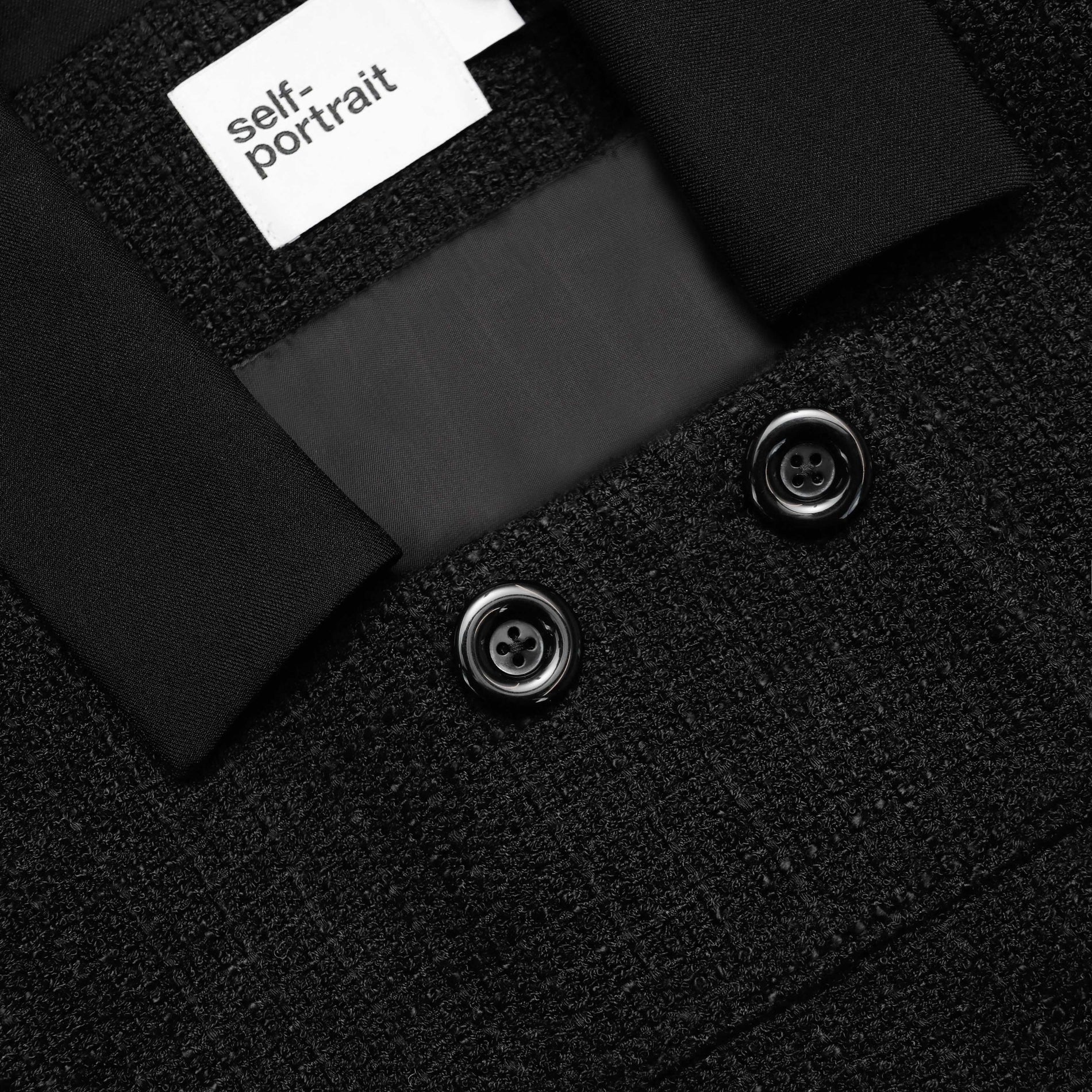 A close up of the fabric for the Black Boucle Cropped Jacket