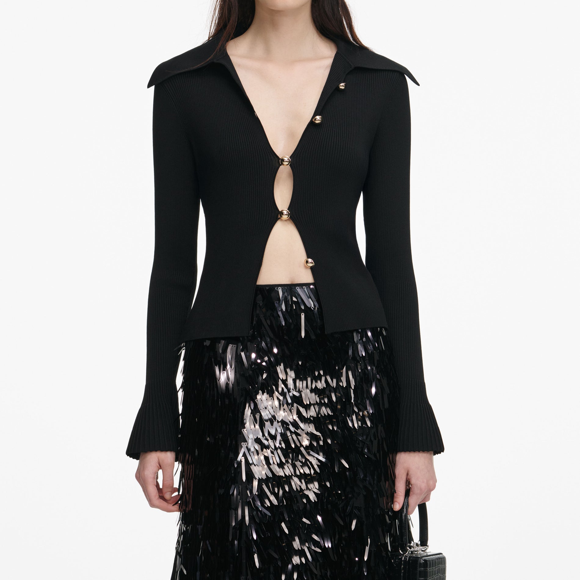 A close up of a woman wearing the Black Button Down Knit Top