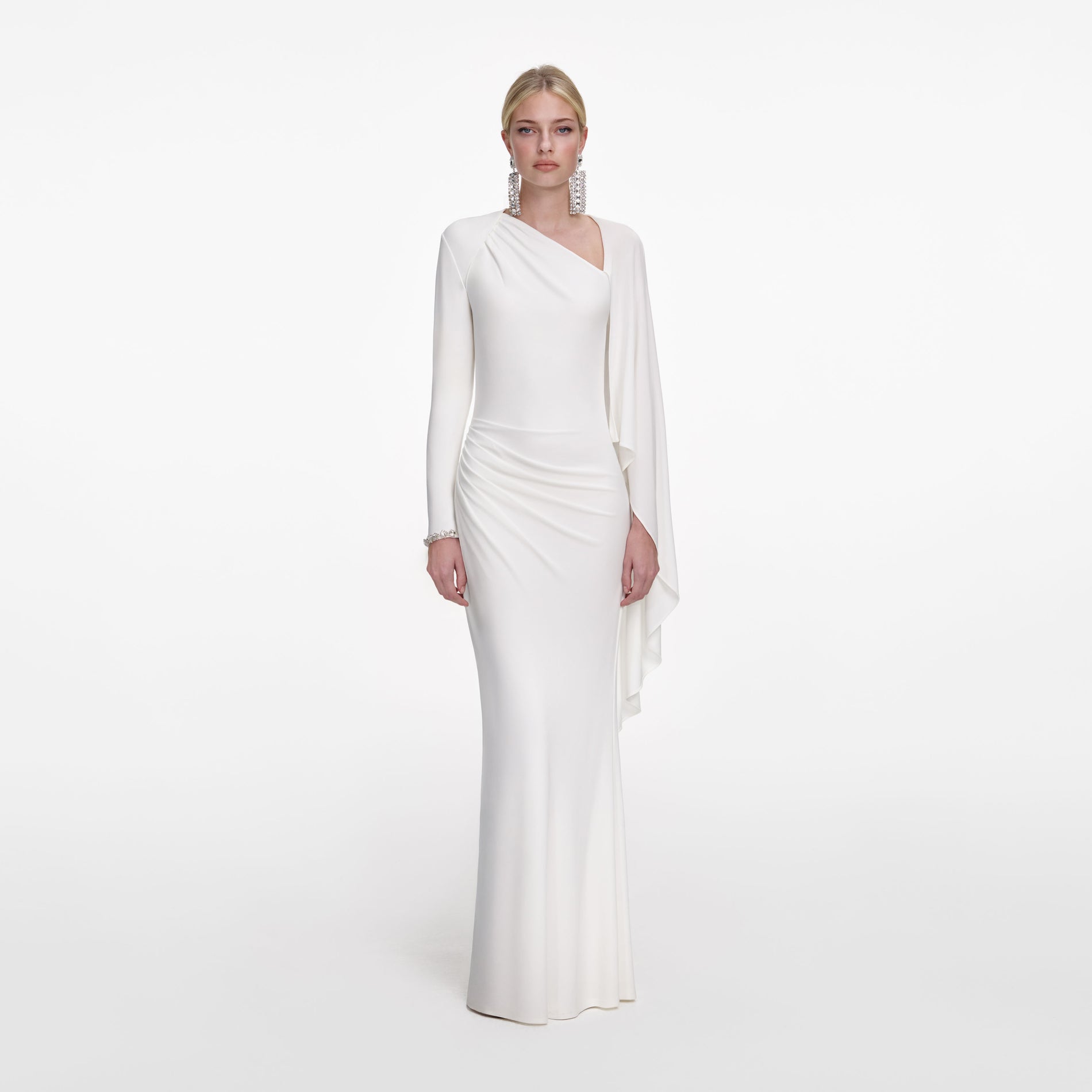 Front view of a woman wearing the White Jersey Drape Maxi Dress
