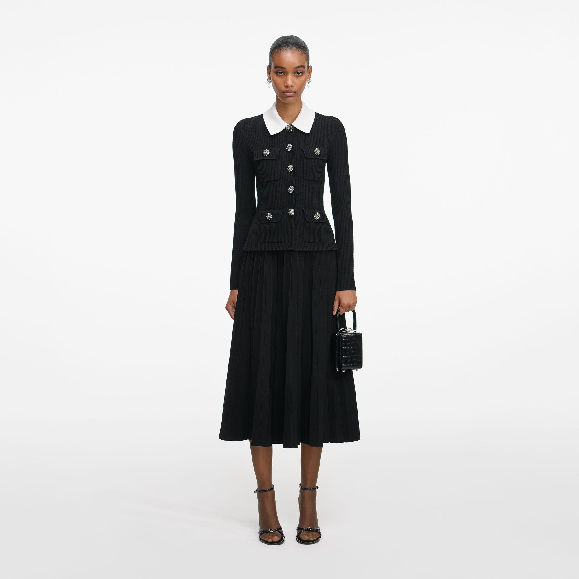 Front view of a woman wearing the Black Tailored Knit Midi Dress