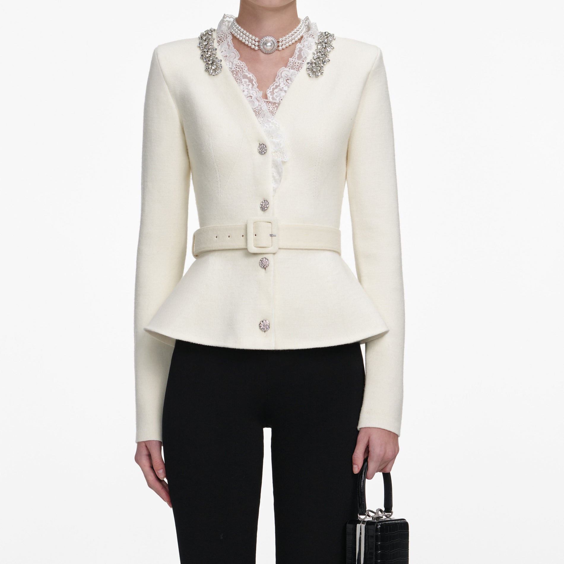 A close up of a woman wearing the Cream Crystal Trim Cardigan