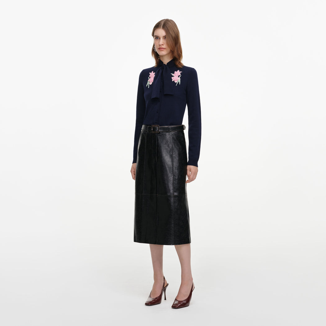 Side view of a woman wearing the Navy Sequin Embellished Knit Cardigan