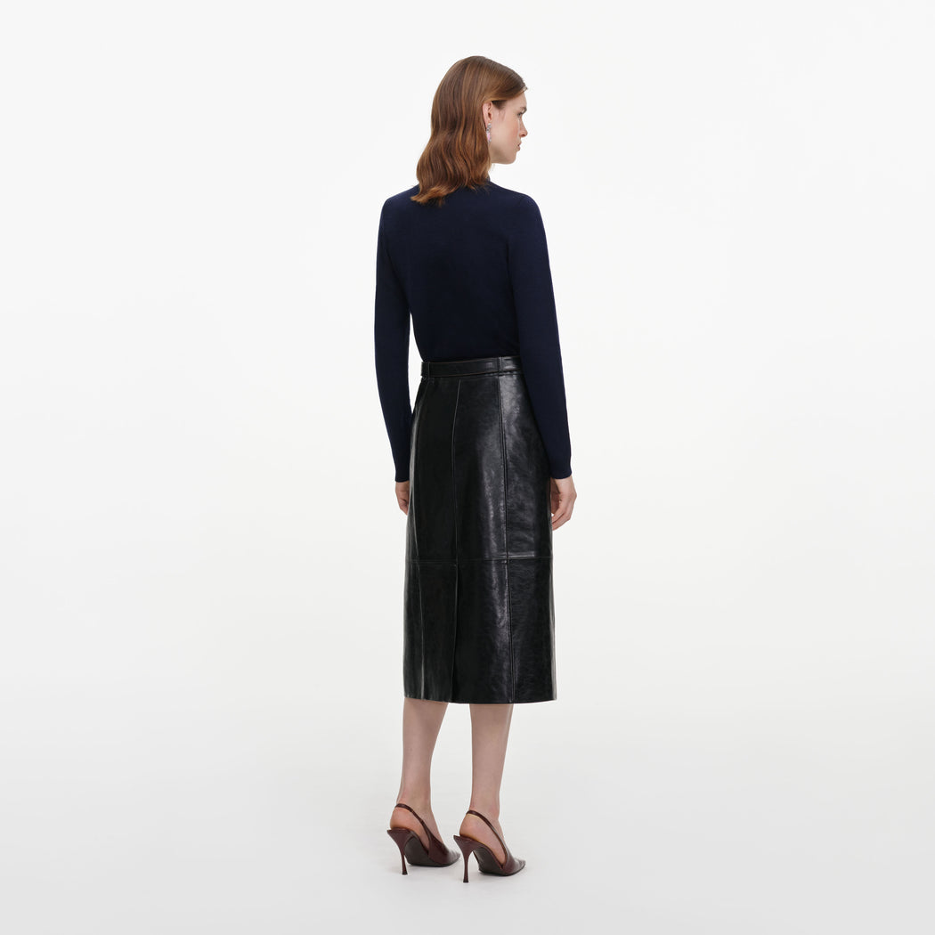 Back view of a woman wearing the Navy Sequin Embellished Knit Cardigan