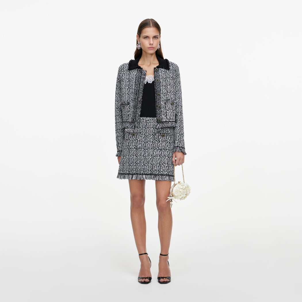 Front view of a woman wearing the Black And White Textured Knit Jacket