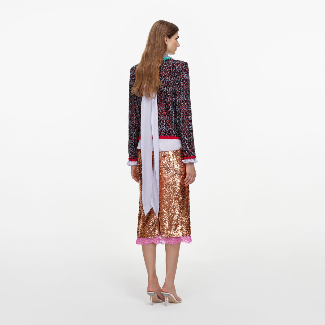 Back view of a woman wearing the Multi Textured Knit Cardigan