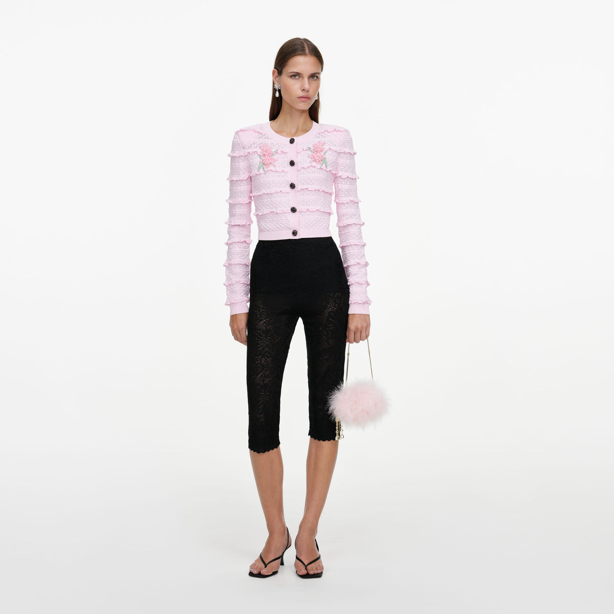 Front view of a woman wearing the Pink Flower Pointelle Knit Cardigan