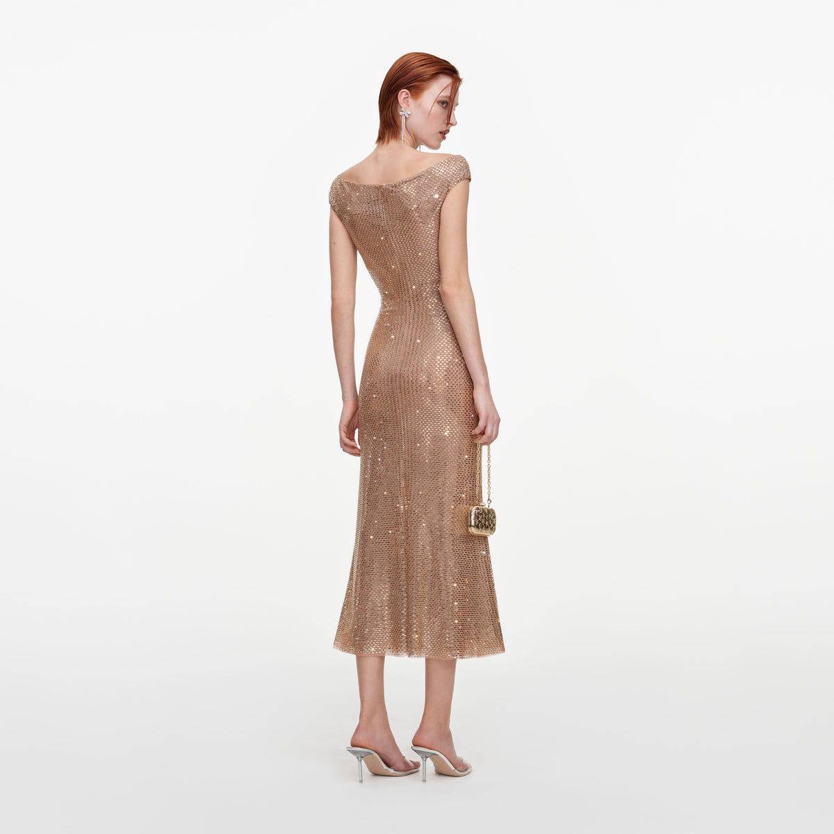 Back view of a woman wearing the Gold Rhinestone Off Shoulder Midi Dress