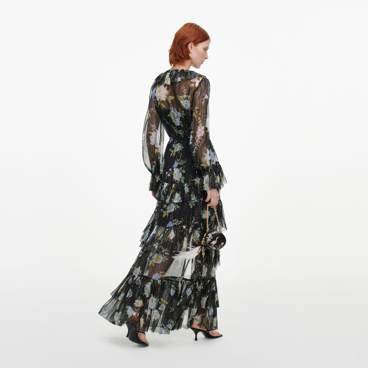 Back view of a woman wearing the Navy Floral Georgette Maxi Dress