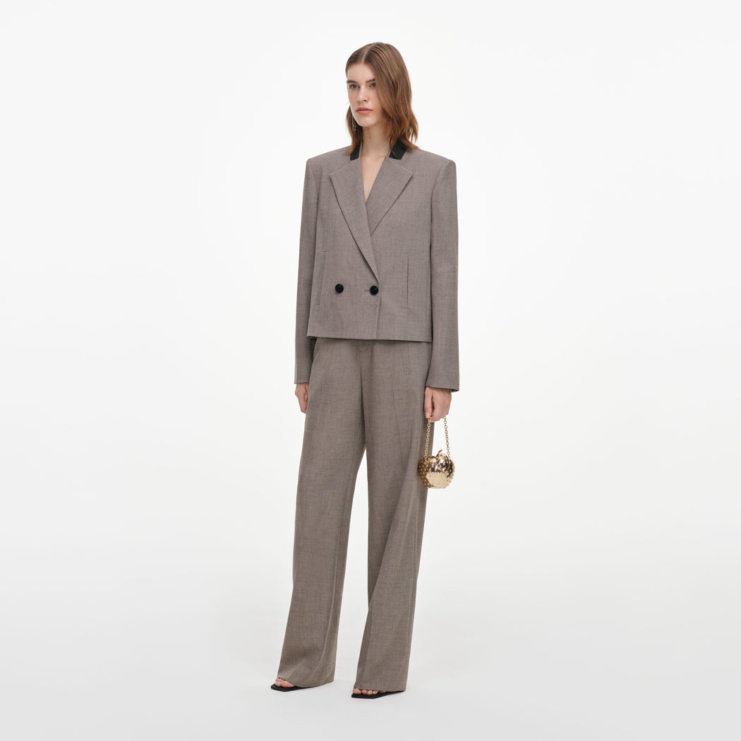 Side view of a woman wearing the Brown Twill Double Breasted Jacket