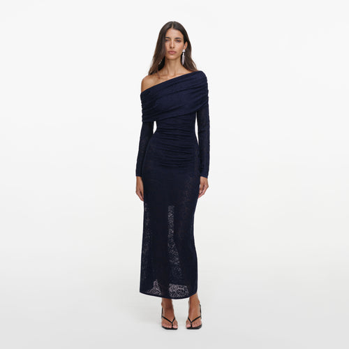 Front view of a woman wearing the Navy Jacquard Gathered Knit Midi Dress