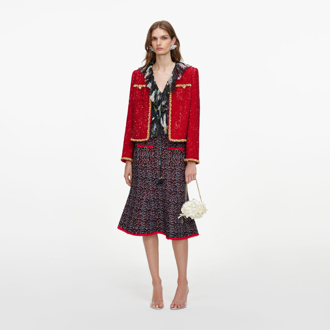 Front view of a woman wearing the Red Sequin Jacket