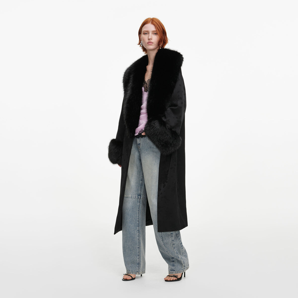 Side view of a woman wearing the Black Jacquard Fur Collar Coat