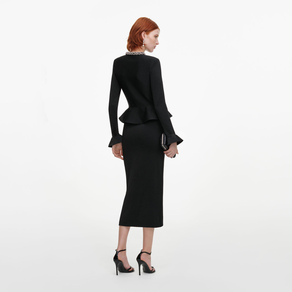 Back view of a woman wearing the Black Crystal Trim Knit Midi Dress