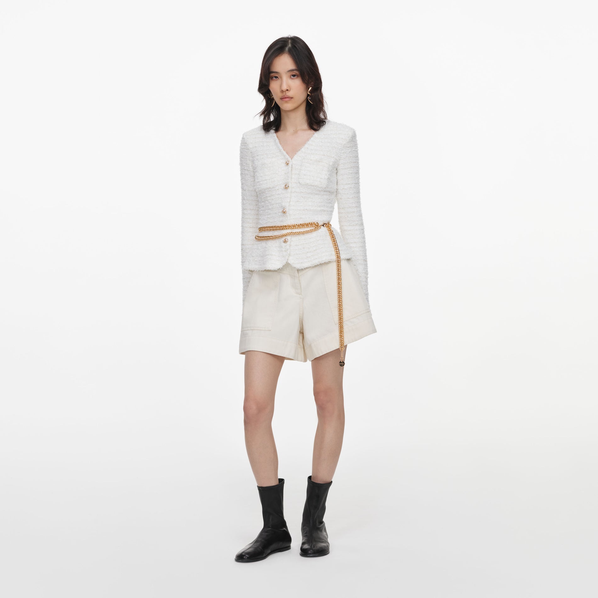 Side view of a woman wearing the Cream Textured Knit Cardigan