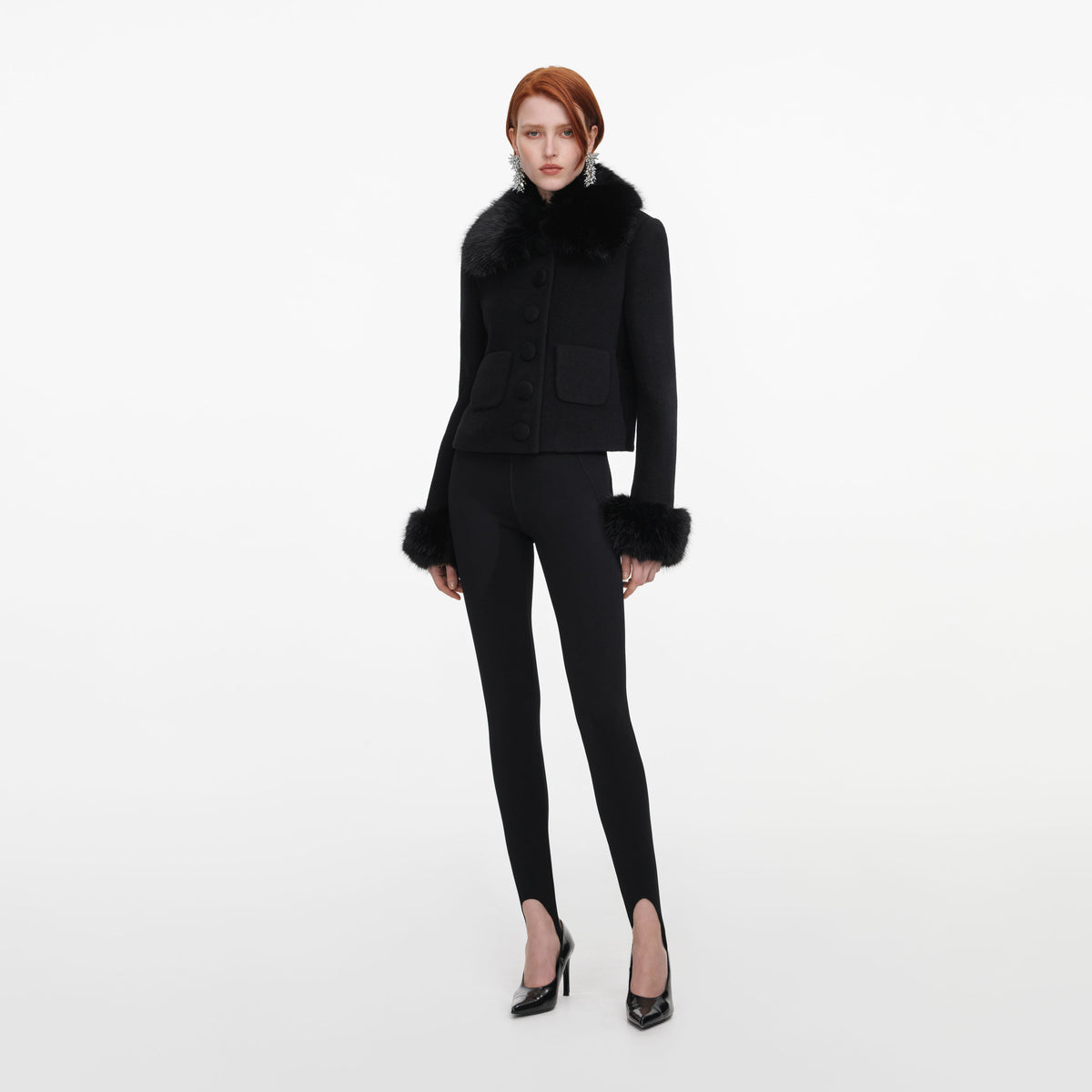Side view of a woman wearing the Black Wool Fur Cuff Jacket