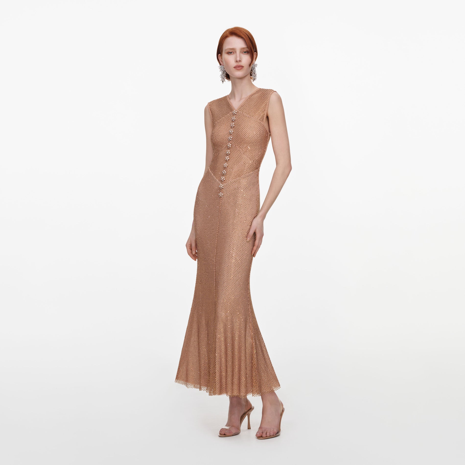 Side view of a woman wearing the Champagne Rhinestone Fishnet Midi Dress