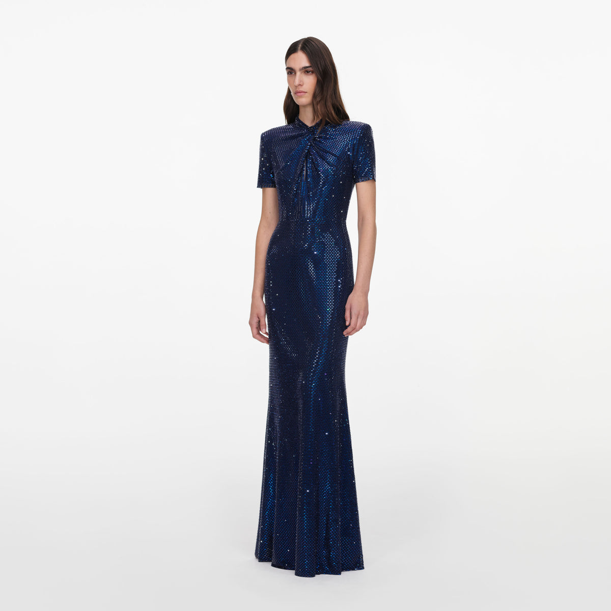 Side view of a woman wearing the Navy Rhinestone Mesh Twist Maxi Dress