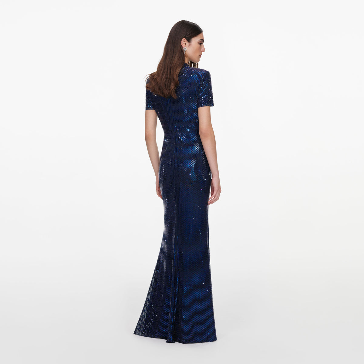 Back view of a woman wearing the Navy Rhinestone Mesh Twist Maxi Dress