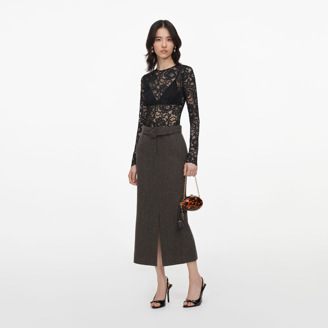 Side view of a woman wearing the Brown Wool Midi Skirt