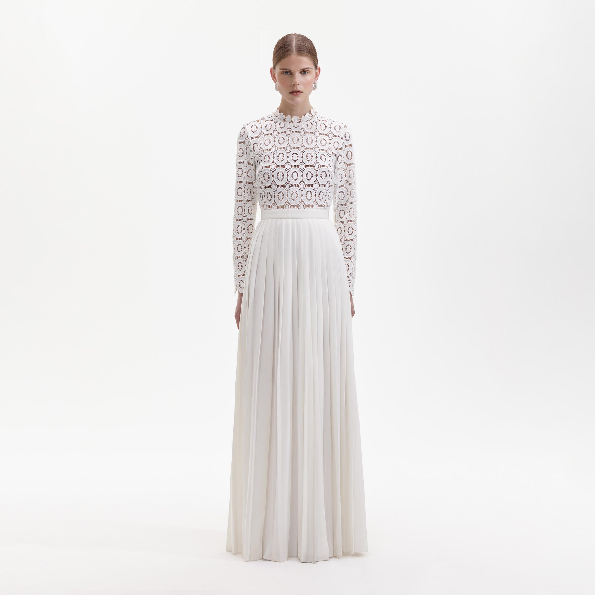 Front view of a woman wearing the Pleated Crochet Floral Maxi Dress