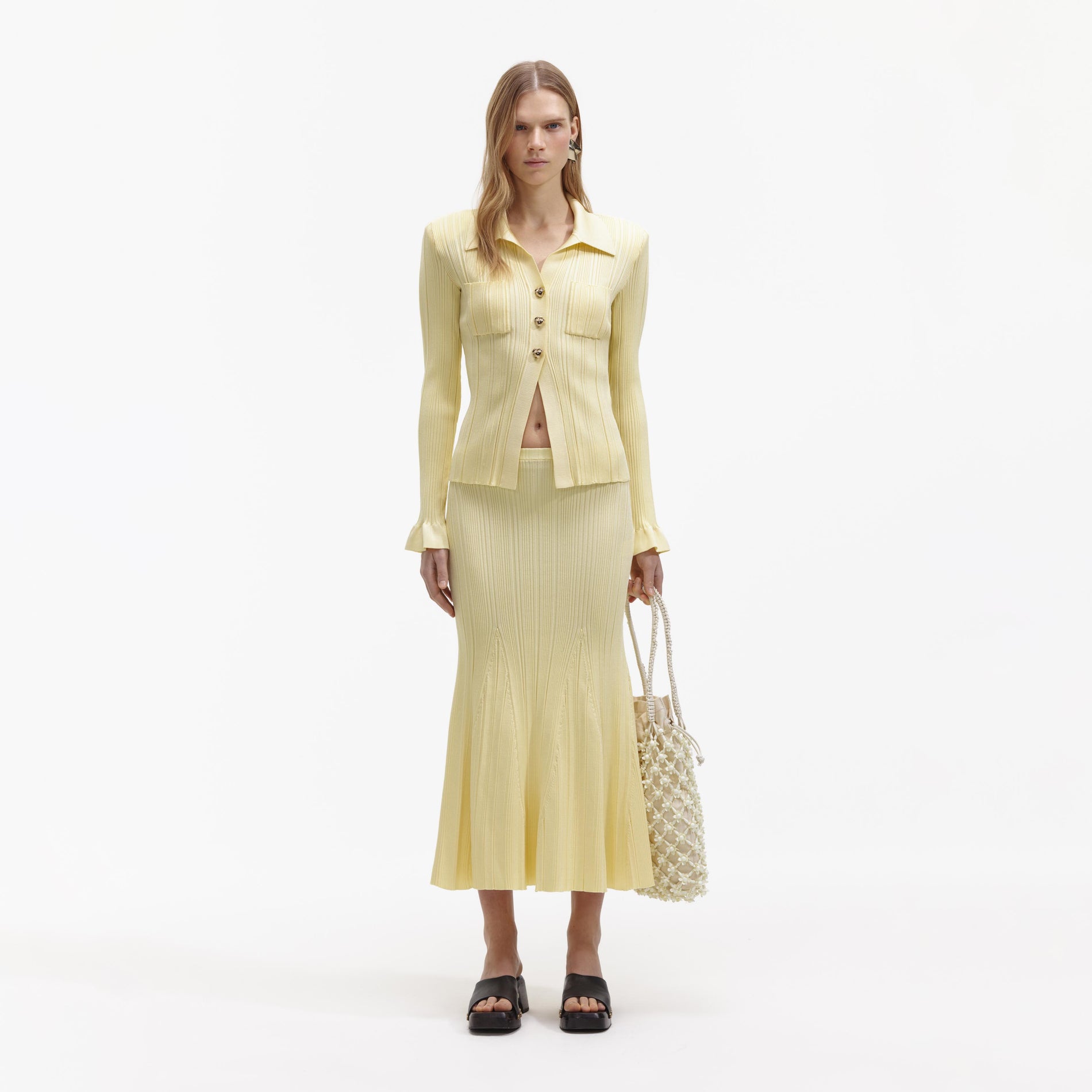 Front view of a woman wearing the Yellow Ribbed Viscose Knit Top