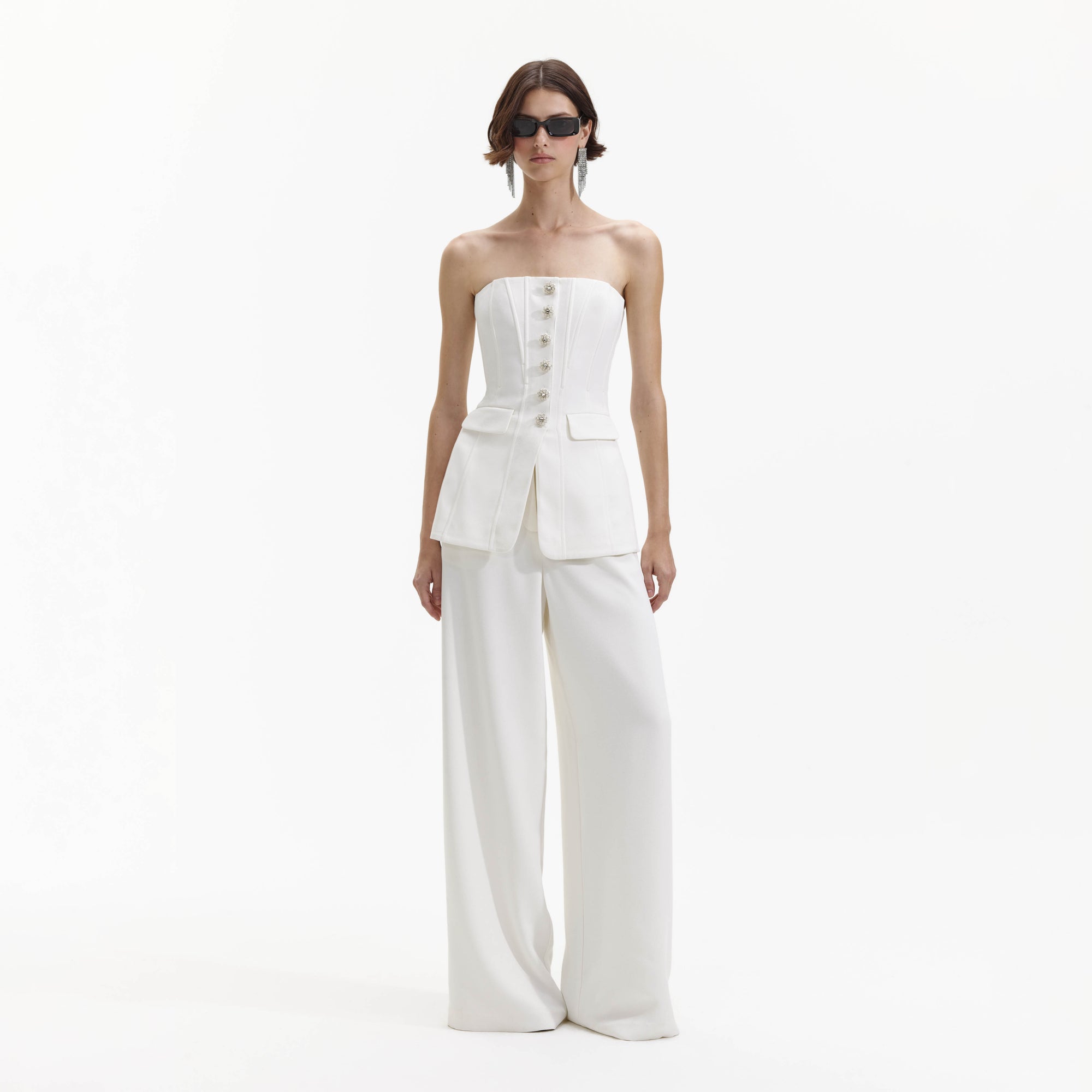 Front view of a woman wearing the White Bandeau Crepe Jumpsuit