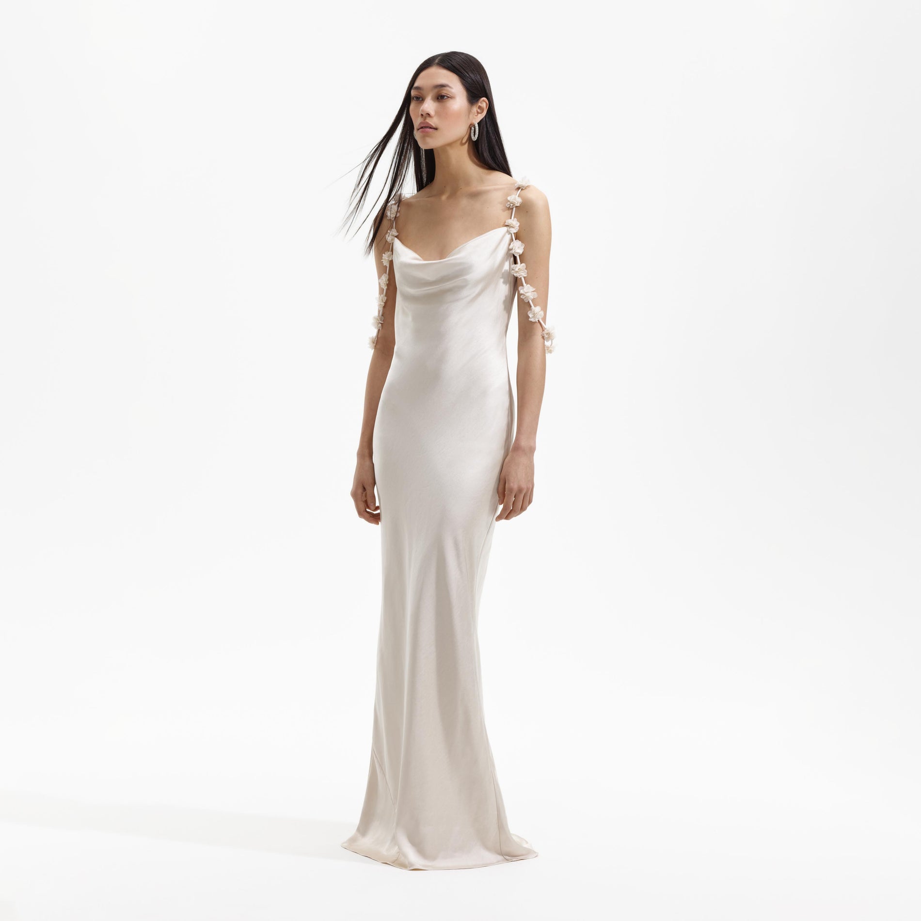 Side view of a woman wearing the Champagne Satin Flower Maxi Dress