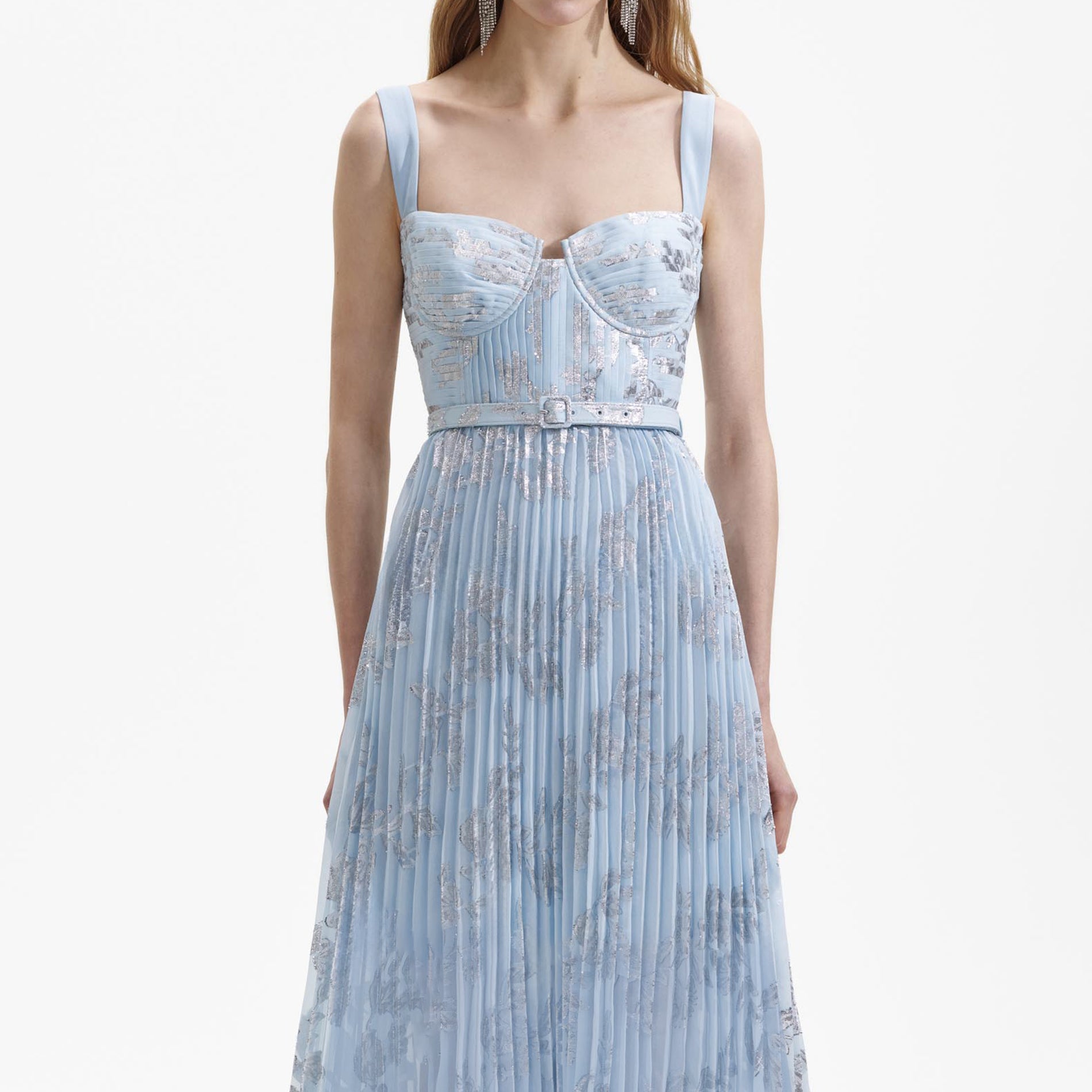 A close up of a woman wearing the Blue Pleated Midi Dress