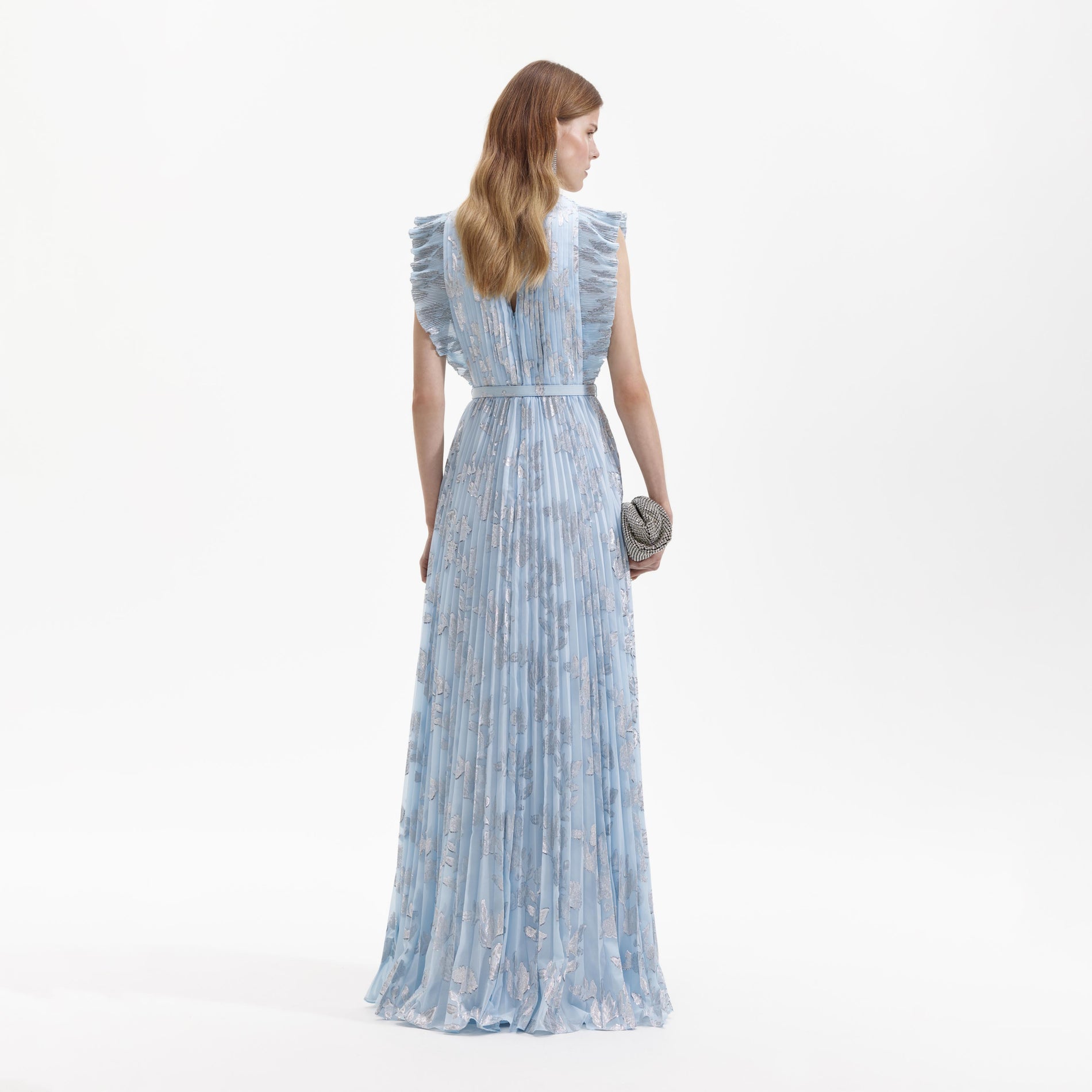 Side view of a woman wearing the Blue Metallic Chiffon Maxi Dress
