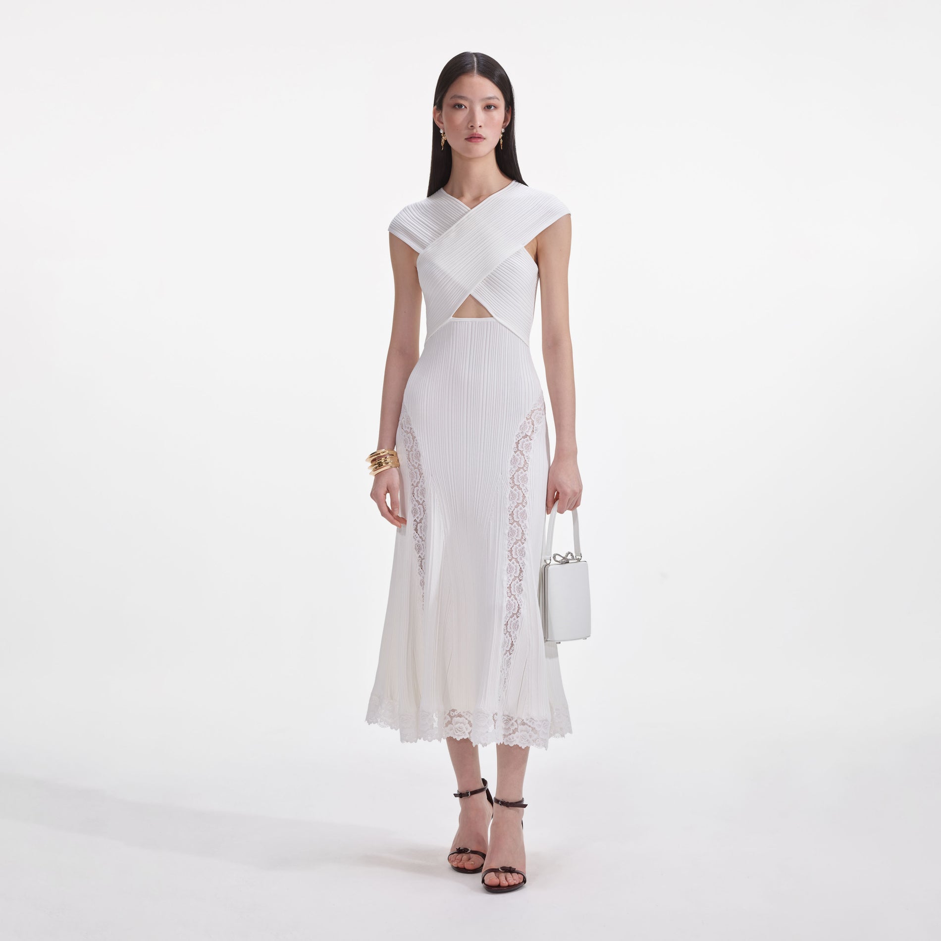 Front view of a woman wearing the White Knit Lace Insert Midi Dress