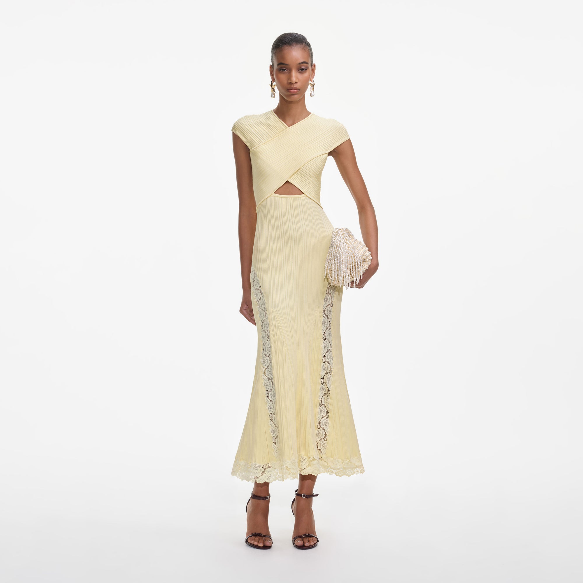 Front view of a woman wearing the Yellow Knit Lace Insert Midi Dress