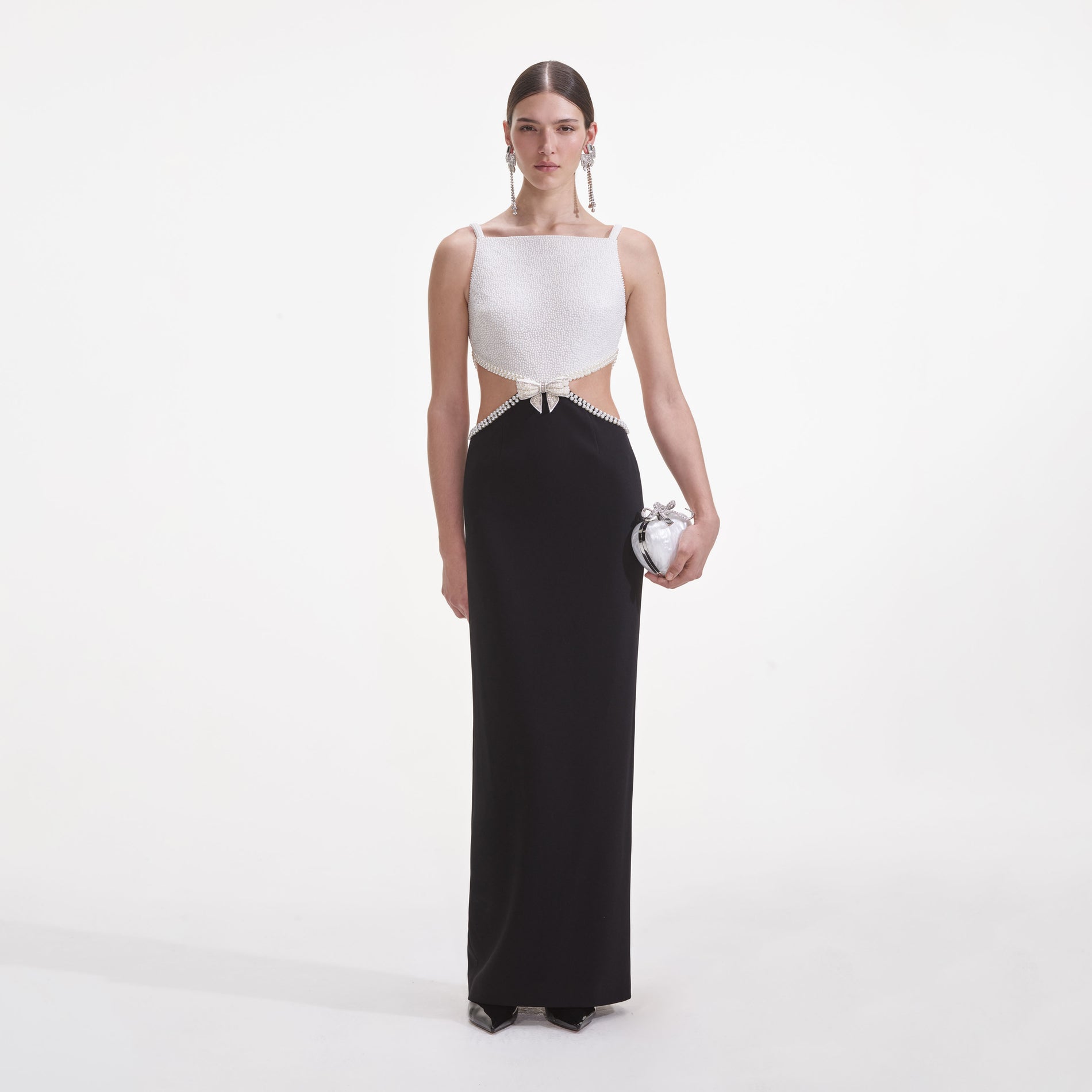 Front view of a woman wearing the Black And White Crepe Maxi Dress