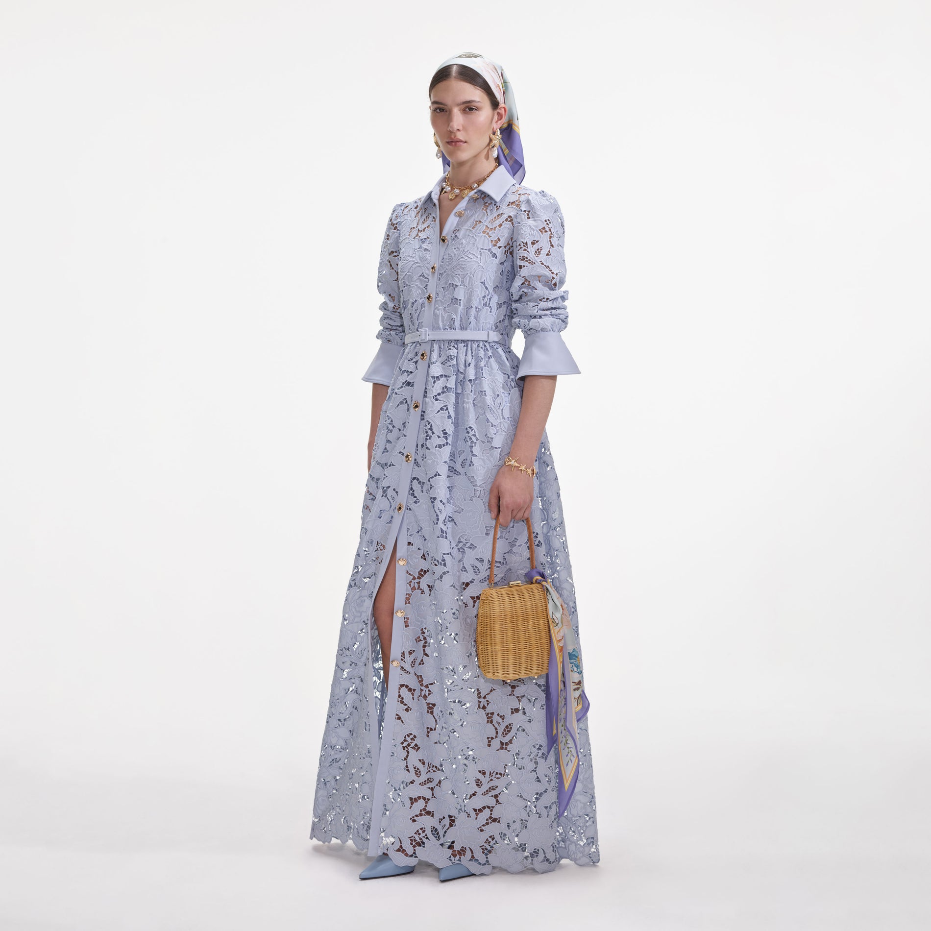 Side view of a woman wearing the Blue Lace Collared Maxi Dress
